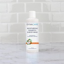 1386_1386_moisturizing-shampoo-and-body-wash_8oz_front-view_bathroom-setting_72dpi_dscgvl